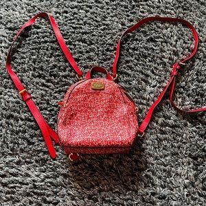 Small Michael Kors floral backpack.